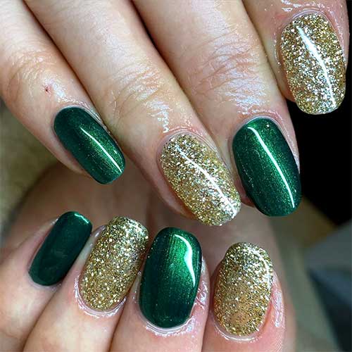 Amazing glossy dark green nails set with gold glitter nails!