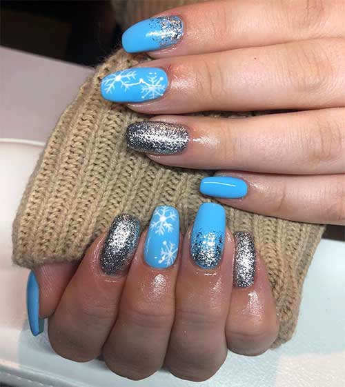 Cute light blue winter nails with gold glitter and white snowflakes design!