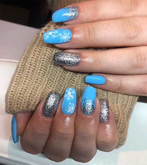 Cute light blue winter nails with gold glitter design! Cute light blue winter nails with gold glitter and white snowflakes design!