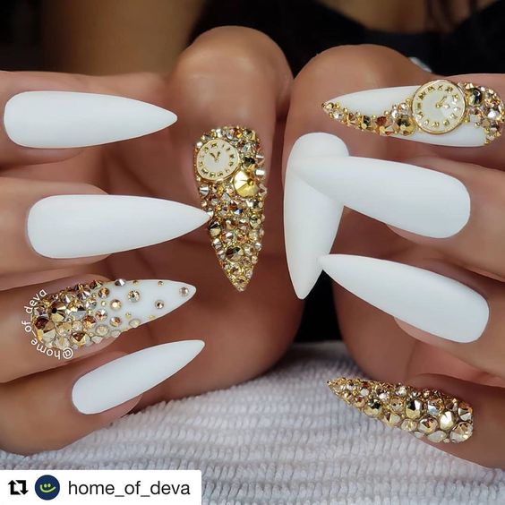 Gorgeous winter white new year's nails with gold rhinestones!