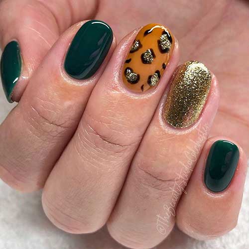 Short round dark green nails 2020 with two accent glitter leopard nail and gold glitter nail
