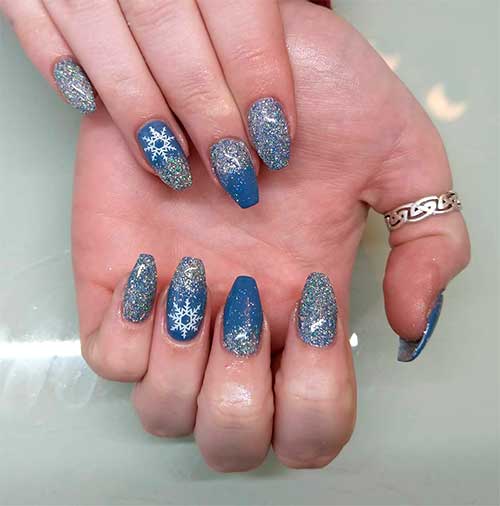 Stunning blue gray nails coffin shaped with glitter and accent snowflake nail!