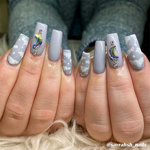Cute light grey cloud nails coffin shaped with rhinestones!