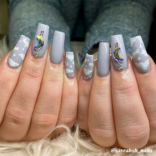 Cute light grey cloud nails coffin shaped with rhinestones! Cute light grey cloud nails coffin shaped with rhinestones!