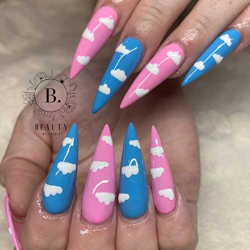 Cute stiletto cloud nails 2020 design consists of light blue and pink colors Cute stiletto cloud nails design consists of light blue and pink colors