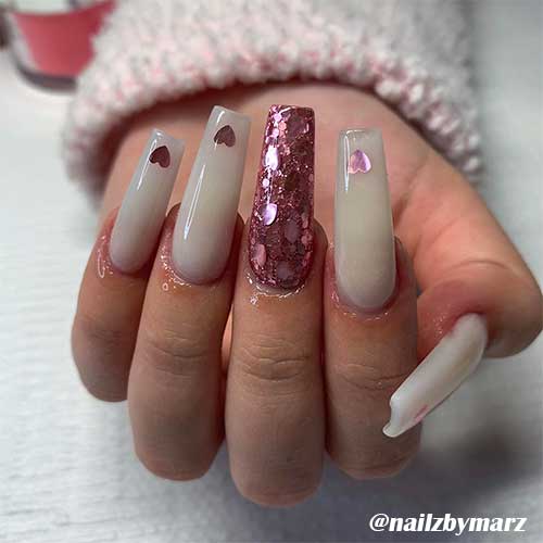 Cute valentines day nails with glitter hearts!