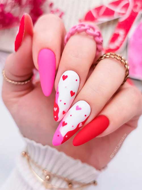 White, Pink and Red Valentine Nails Long matte white, pink, and red valentine nails 2023 with heart shapes to celebrate Valentine’s Day