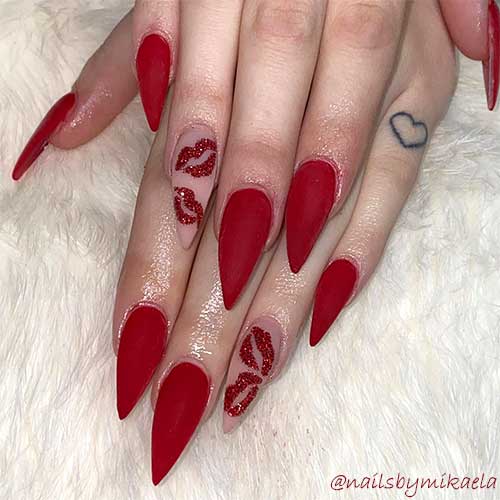 Matte red simple valentines day nails 2020 stiletto shaped with red glitter kisses on accent nude nail