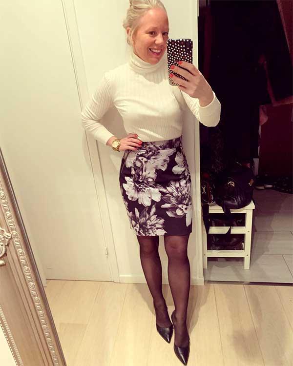 Sweater and pencil skirt outfit idea of white turtle neck sweater for women and a mini flower pencil skirt