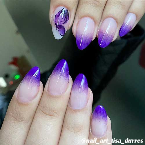 Almond shape purple french ombre nails 2020 with a butterfly on accent nail for spring season