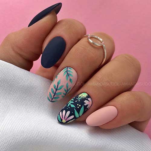Cute almond spring matte nails 2020 design consists of nude and navy matte nails with flowers and leaves Cute almond spring matte nails 2020 design consists of nude and navy matte nails with flowers and leaves