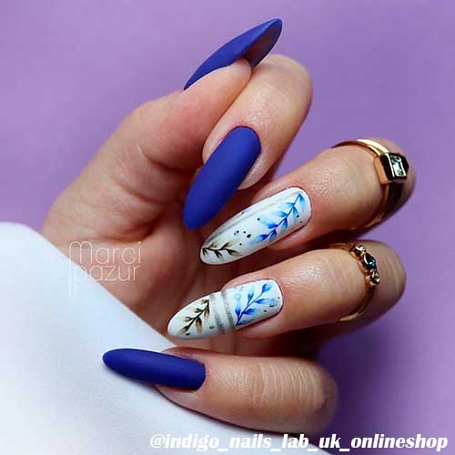 Cute deep cobalt spring matte nails 2020 almond shaped with two accent leaves nails