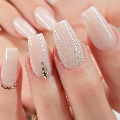 Cute nude nails with glitter and rhinestones design! Cute nude nails with glitter and rhinestones design!