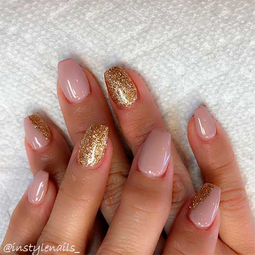 Cute short nails nude with gold glitter that suit nails 2020 trend
