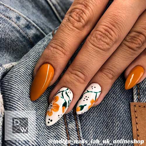 Gorgeous burnt orange flower acrylic nails almond shaped for spring 2020