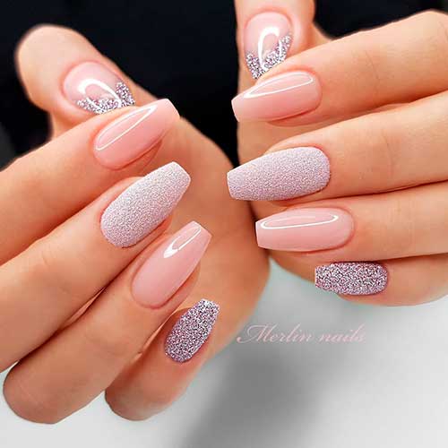 Gorgeous coffin shaped nude nails with glitter accent nails design!