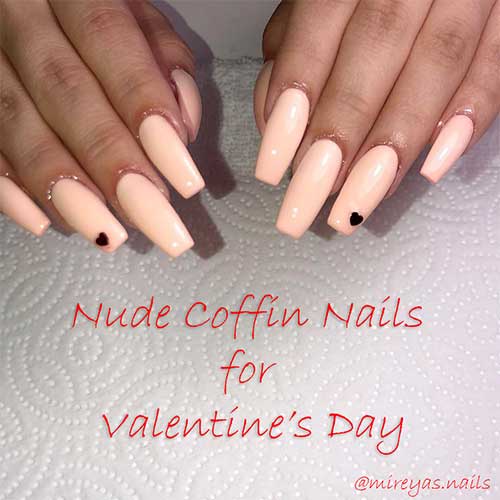 Nude coffin nails with small dark red heart on accent nail for valentine's day