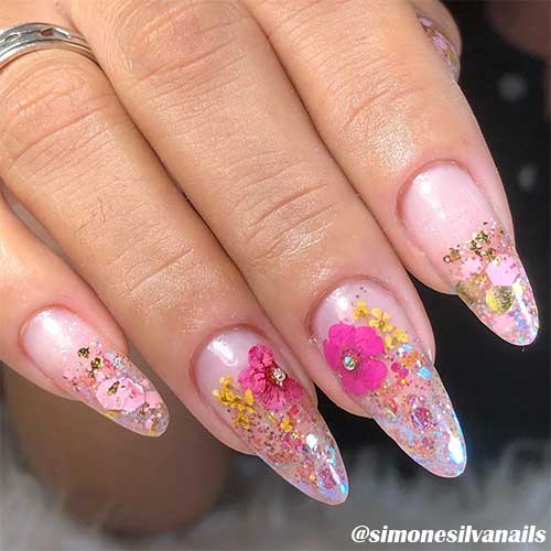 Spring clear almond flower acrylic nails 2020 set that adorned with some gold foil and a rhinestone on the flower center Spring clear almond flower acrylic nails 2020 set that adorned with some gold foil and a rhinestone on the flower center