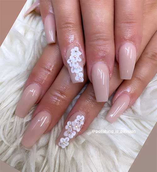 Spring floral nude acrylic nails design with 3d flowers on ring fingernail