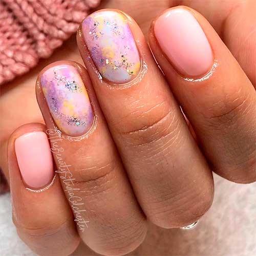 Pink short spring nails with two accent pastel multicolor acrylic nails with glitter