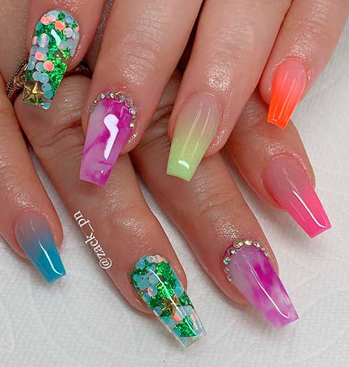 Cute mixed color ombre nails 2020 with two accent marble and glitter nails, and adorned with rhinestones!