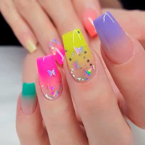 Mixed color ombre nails 2020 coffin design with butterfly glitter on two accent nails 2020 for summer time Mixed color ombre nails 2020 coffin design with butterfly glitter on two accent nails 2020 for summer time