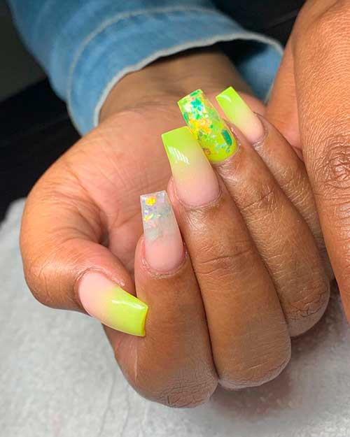 Summer lime green ombre neon nails 2020 with glitter flakes over the clear accent nail and also over the lime green accent nail for summer 2020