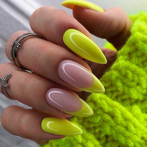 Fabulous neon yellow almond nails design with two accent French almond nails!