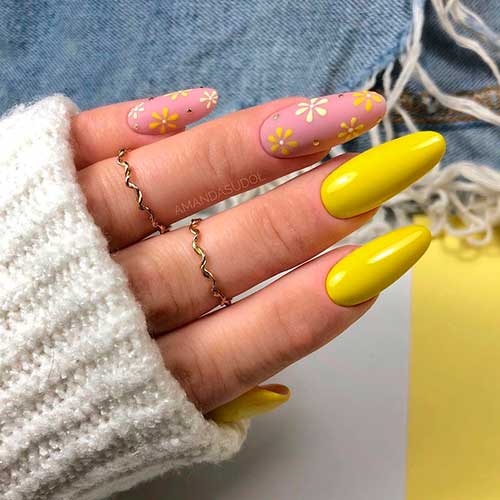 Almond shaped yellow nails with floral nail art on nude color nails for spring 2021! Almond shaped yellow nails with floral nail art on nude color nails for spring 2021!