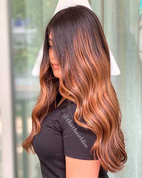 Caramel hair color with sleek curls and waterfall curls style