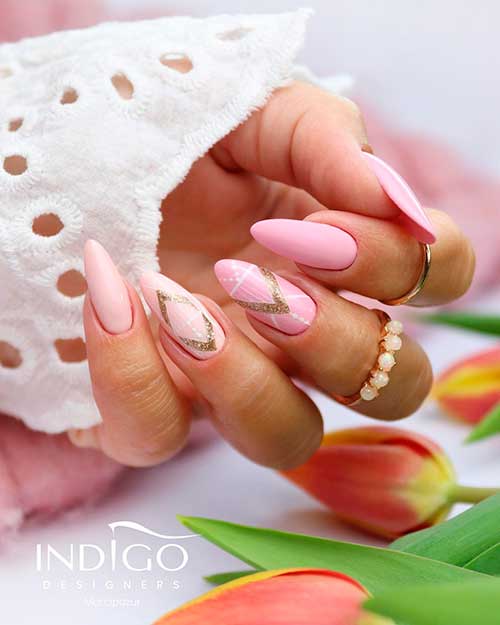 Cute almond shaped nails 2021 with different pink shades with white and gold splatters!