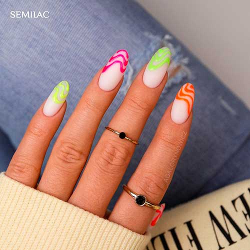 Cute almond shaped summer nails 2021 with assorted neon colors on tips for summertime!