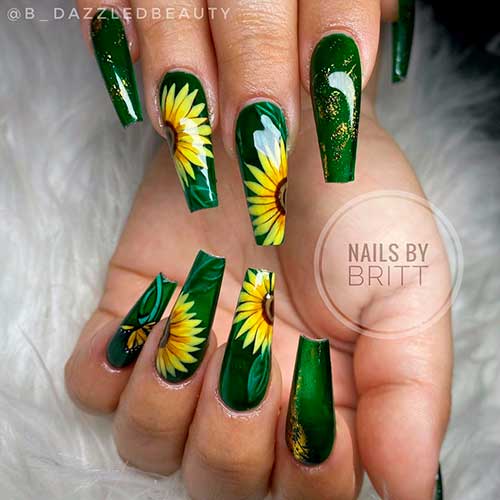 Cute summer green nails 2021 with hand painted sunflowers and touches of gold glitter for summertime!