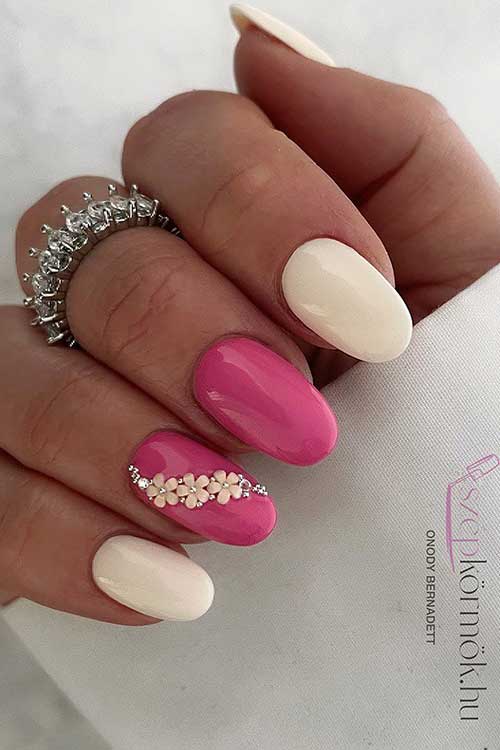 Short Round Shaped Pink and White Nails with Rhinestones and Floral Nail Art on An Accent Nail