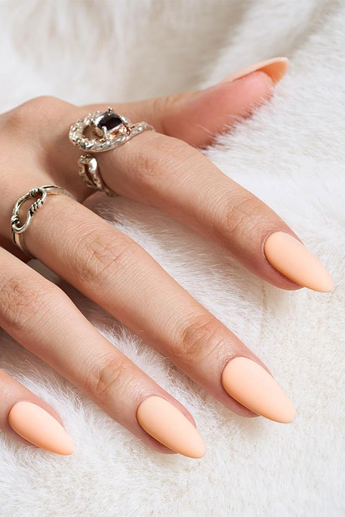 Cute matte peach press on nails in an almond shape Cute matte peach press on nails in an almond shape