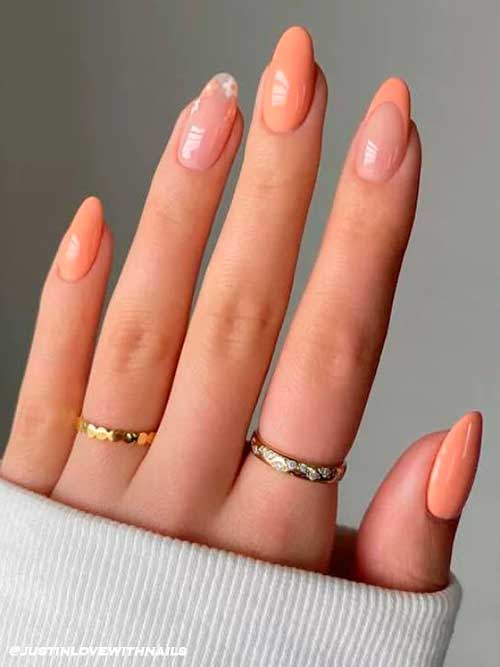 Elegant Almond Peach Nails with Flower Accent and Peachy French Accent