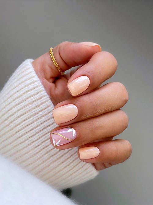 Soft short peach nails with a nude accent nail adorned with white flowers and a gold chrome swirl Soft short peach nails with a nude accent nail adorned with white flowers and a gold chrome swirl