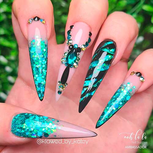long stiletto Summer Nails 2021 consists of glitter turquoise nails over nude color base with accent black nail