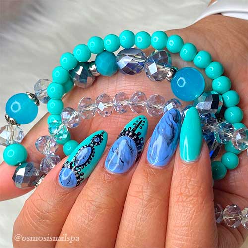 Throwback in Summertime Almond-shaped turquoise nails 2021 with marble blue nail design for summer time