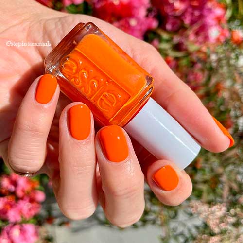 Cute short orange nails with tangerine tease Essie Nail Polish for summer 2021