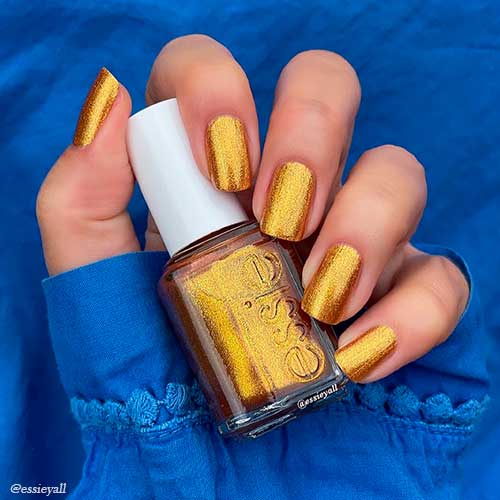 Cute bronze shimmery short nails use get your groove on essie nail polish 2021