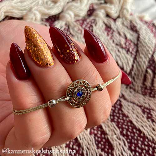 Glossy Dark Red Autumn Nails Glossy Dark Red Fall Nails with Gold Glitter Considered Classy Autumn Nails