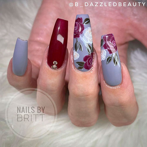 Dark Red and White Floral Nail Art Over Grey Nails and Accent Dark Red Nail are Considered Perfect Fall Nails 2021