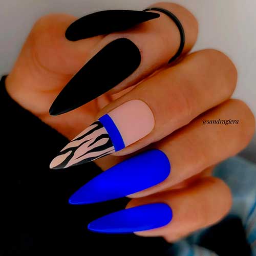 Long Stiletto Matte Black and Royal Blue Nail Design with Zebra Prints on Accent Nude Base Nail