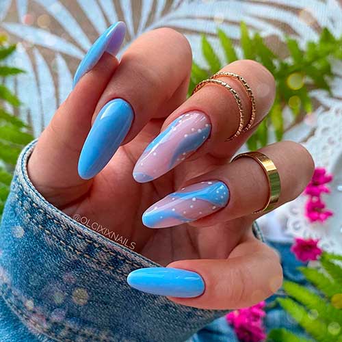 Long almond light blue nails with two accent decorative nude and blue nails with white dots