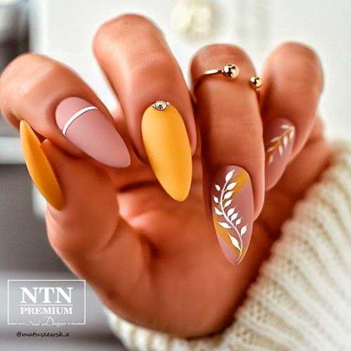 Yellow and Nude Autumn Nails Yellow and Nude Autumn Nails with Leaf Nail Art is Perfect Fall Nails 2021