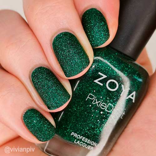Gorgeous short shimmering emerald green nails with two coats of pixie dust Elphie nail polish