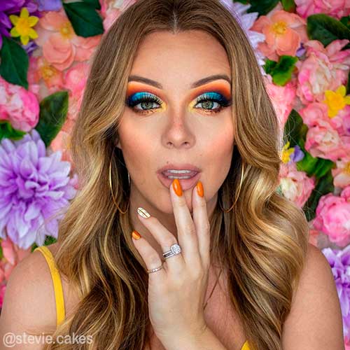 Gorgeous colorful fall makeup looks 2021 that uses orange, yellow, and blue eyeshadows