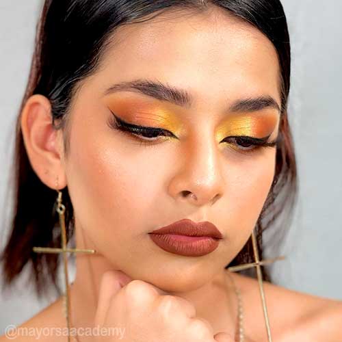 The Autumn Ombre golden yellow to burnt orange with winged eye makeup is one of the perfect fall makeup looks 2021