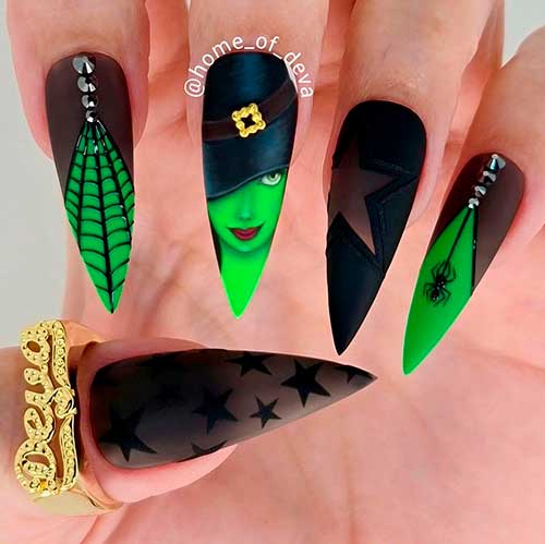 Black and green witch nails stiletto shape design is on of the best Halloween nail designs in 2021